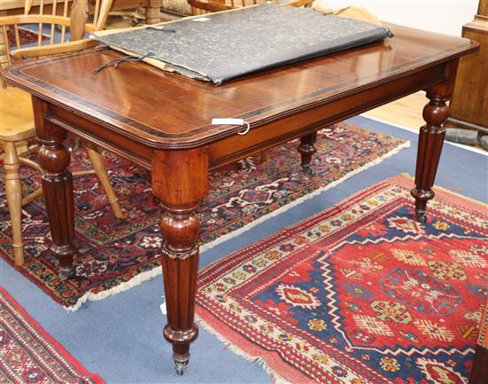 An early 19th century mahogany writing table with cross banded top W.144cm